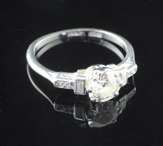 A 1920s 18ct gold and platinum single stone diamond ring size M.